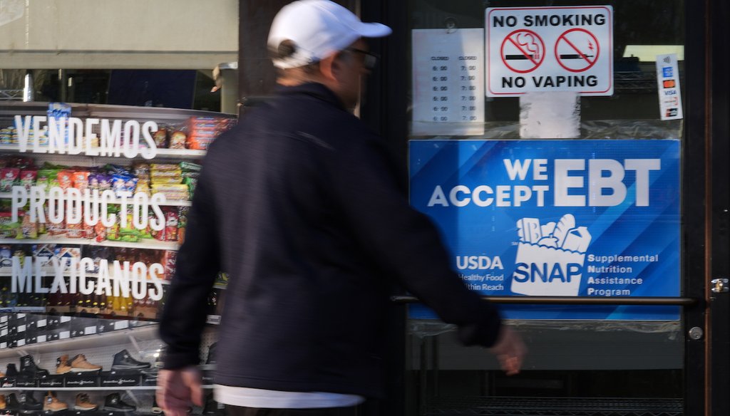 A customer walks into a bakery as a SNAP EBT information sign is displayed at the front door in Chicago, Nov. 2, 2025. (AP)