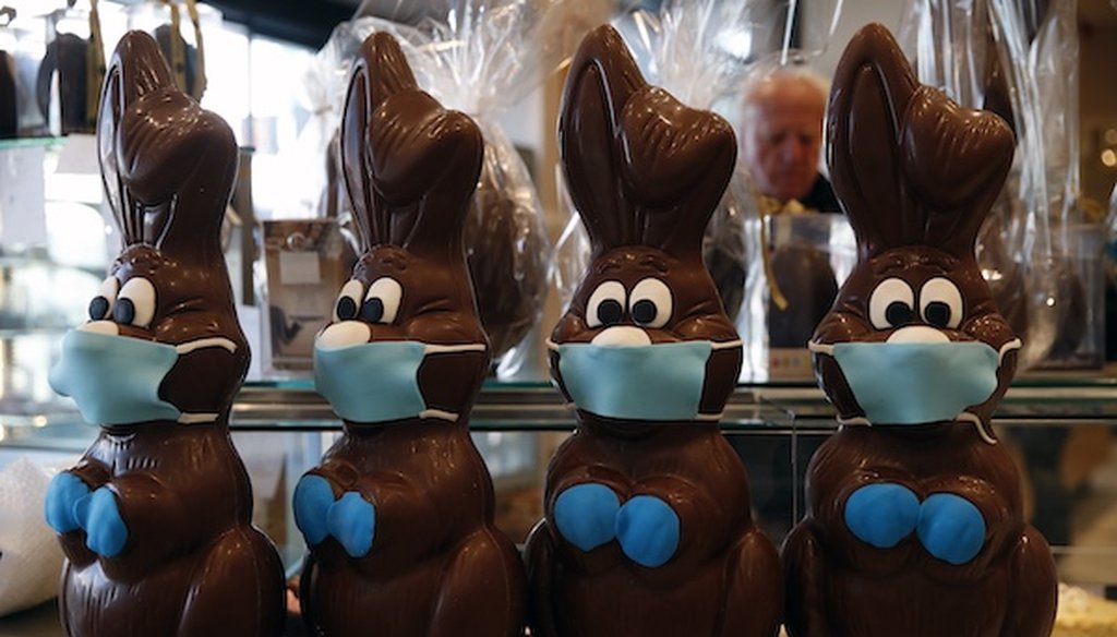 Chocolate Easter bunnies with masks are on display at a cake shop in northern Athens on April 8, 2020. (Associated Press)