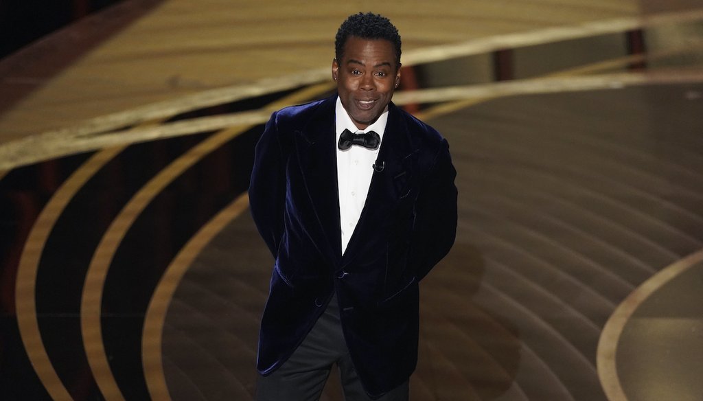 Chris Rock presents the award for best documentary feature at the Oscars on Sunday, March 27, 2022, at the Dolby Theatre in Los Angeles. (AP)