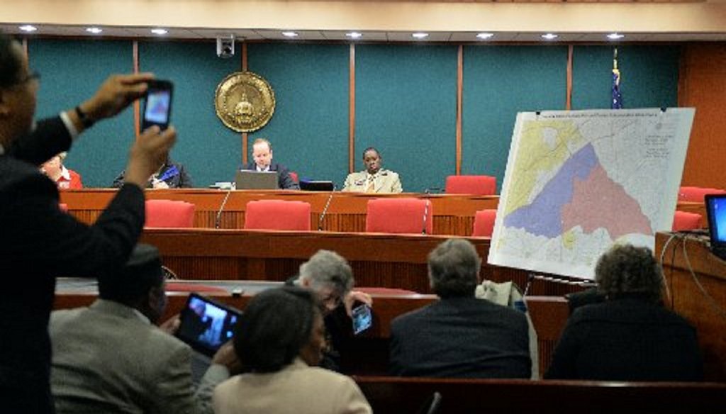 Cityhood supporters took photos of the LaVista Hills/Tucker compromise map when it was released in December. Photo by Kent D. Johnson / AJC.
