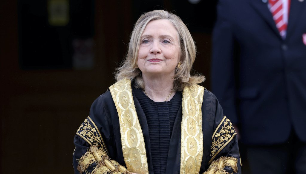 Former U.S. Secretary of State Hillary Clinton poses for a photo after being inaugarated as the first female chancellor of Queens University, in Belfast, Northern Ireland, Friday, Sept. 24, 2021. (AP)