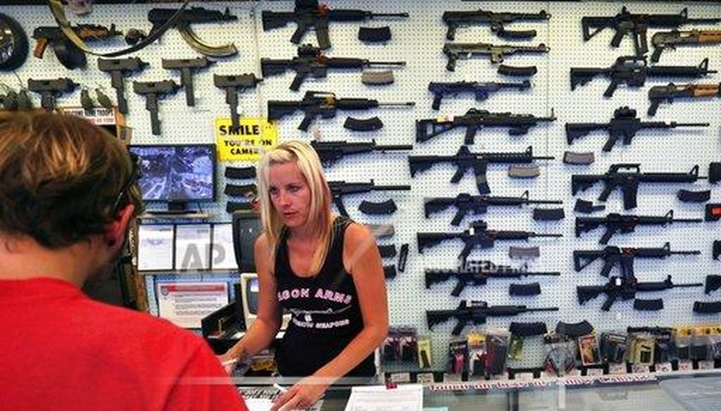 With exceptions, Colorado requires that anyone transferring possession of a gun must arrange for a background check to be done like those that are required of gun stores such as this one in Colorado Springs. (AP)