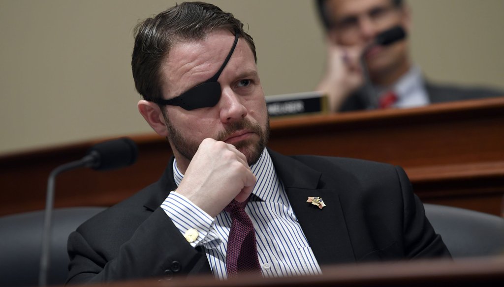 U.S. Rep. Dan Crenshaw, R-Texas, listens to testimony during a congressional hearing in March. (AP Photo/Susan Walsh)