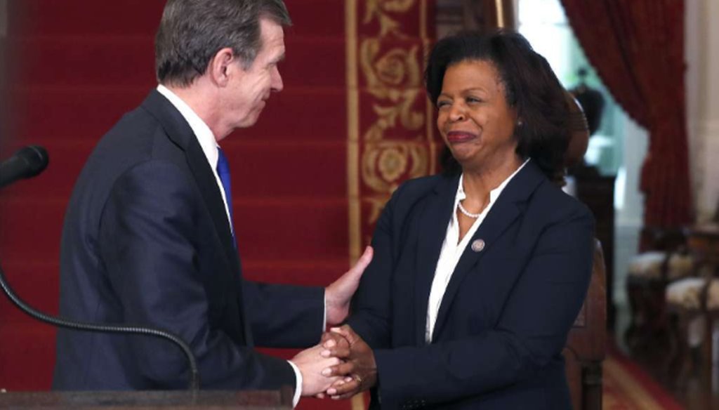 North Carolina Gov. Roy Cooper, left, congratulates Cheri Beasley after naming her as the next Chief Justice of the NC Supreme Court during a press conference in Raleigh on Feb. 12, 2019. (News & Observer)