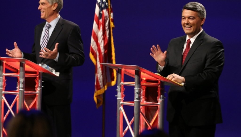 Sen. Mark Udall, D-Colo., left, and U.S. Rep. Cory Gardner, R-Colo., greet the audience at the start of a televised debate on Oct. 15, 2014. 