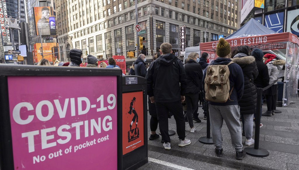 People wait in line to get tested for COVID-19 at a mobile testing site in Times Square on Friday, Dec. 17, 2021, in New York. (AP)
