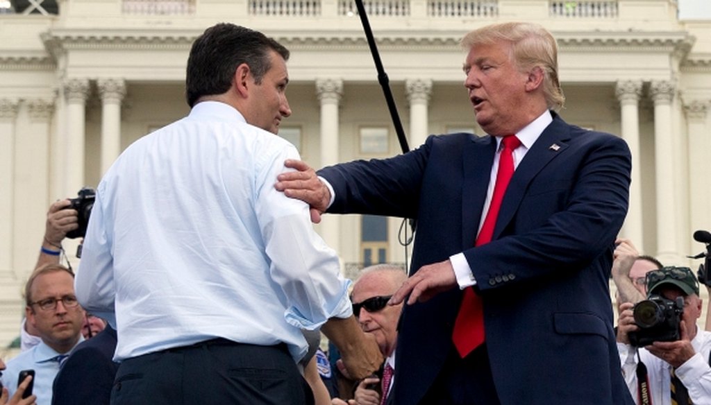 Republican presidential candidates Ted Cruz (left) and Donald Trump greet each other on stage during a rally to oppose the Iran nuclear agreement on Capitol Hill on Sept. 9, 2015. (AP/Carolyn Kaster)