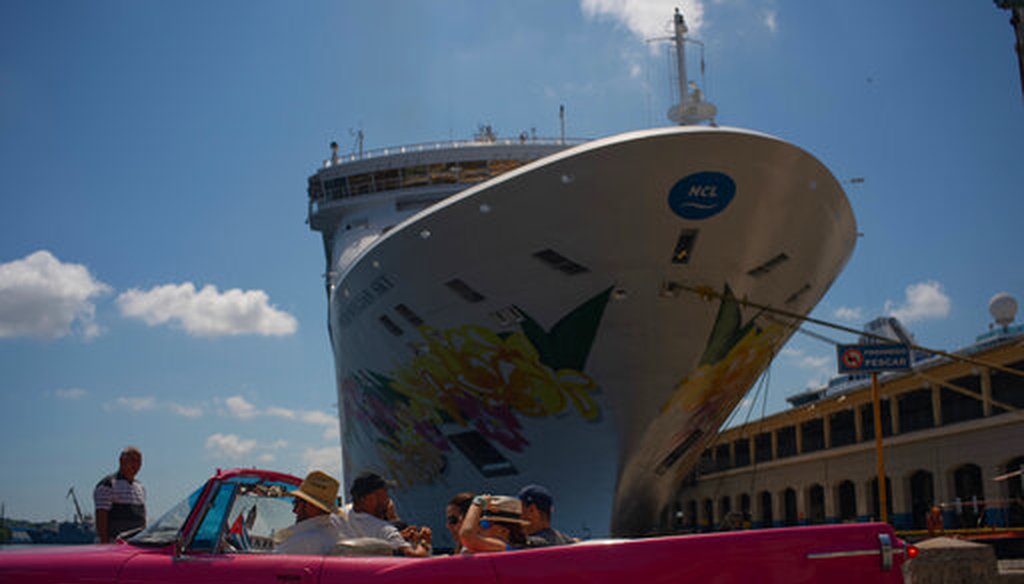 Tourists who have just disembarked from a cruise liner, tour the city aboard a vintage American convertible, in Havana, Cuba, Tuesday, June 4, 2019. The Trump administration has imposed major new travel restrictions on visits to Cuba by U.S. citizens. (AP