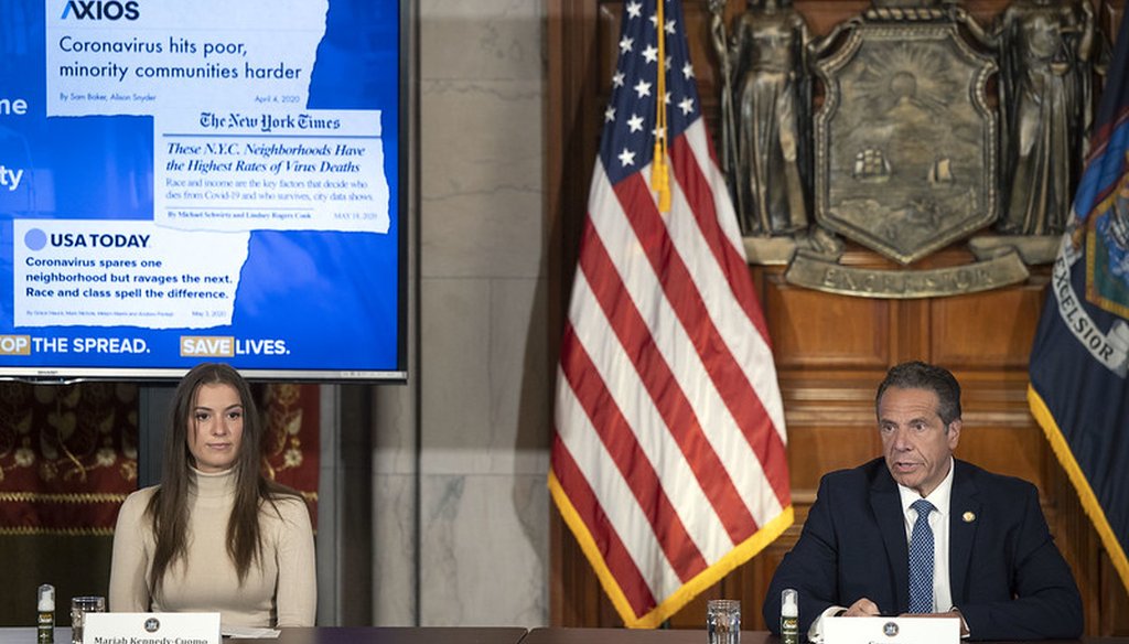 Gov. Andrew Cuomo gives a coronavirus update on May 20, 2020, in the State Capitol. At left is Mariah Kennedy Cuomo. (courtesy Gov. Andrew Cuomo's office)