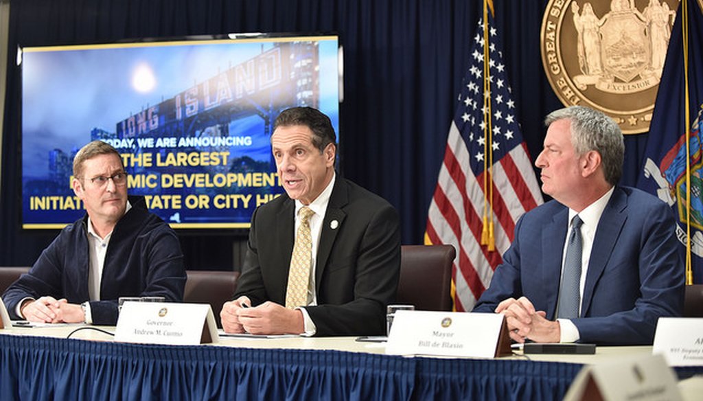 Gov. Andrew Cuomo, New York City Mayor Bill de Blasio, and John Schoettler, vice president of global real estate and facilities for Amazon, announce a deal to bring Amazon to Queens. (Courtesy Gov. Andrew Cuomo)
