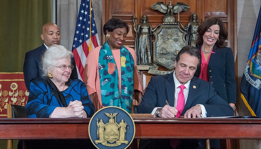 Gov. Andrew Cuomo signs the Reproductive Health Act into law in the Red Room in the State Capitol on Jan. 22, 2019. (flickr/governorandrewcuomo)