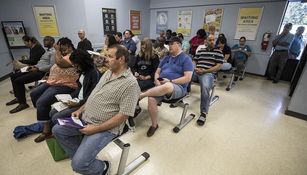 North Carolina residents wait inside the DMV on Spring Forest Road in Raleigh, many of them hoping to obtain a Real ID, on Wednesday, August 8, 2018. (Julia Wall/N&O)