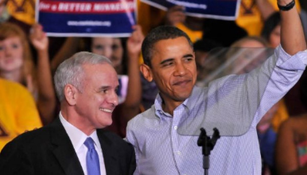 Mark Dayton, then running for his first term as Minnesota governor, and President Barack Obama,  wave to the crowd during a get-out-the-vote rally at the University of Minnesota in October 2010.