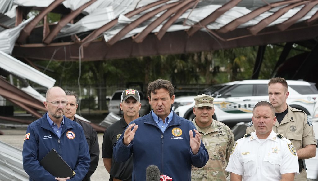 Florida Gov. Ron DeSantis speaks during a news conference in front of a St. Lucie County Sheriff's parking facility that was damaged by a tornado spawned ahead of Hurricane Milton on Oct. 10, 2024, in Fort Pierce. (AP)