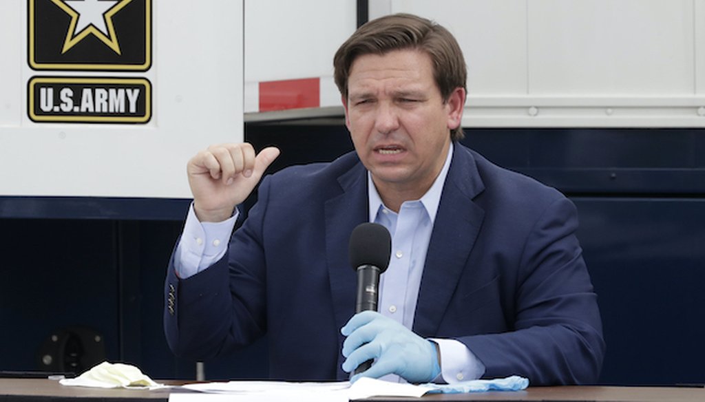 Florida Gov. Ron DeSantis gestures as he speaks during a news conference in front of a U.S. Army Corps of Engineers mobile command center at the Miami Beach Convention Center on April 8, 2020. (Associated Press)