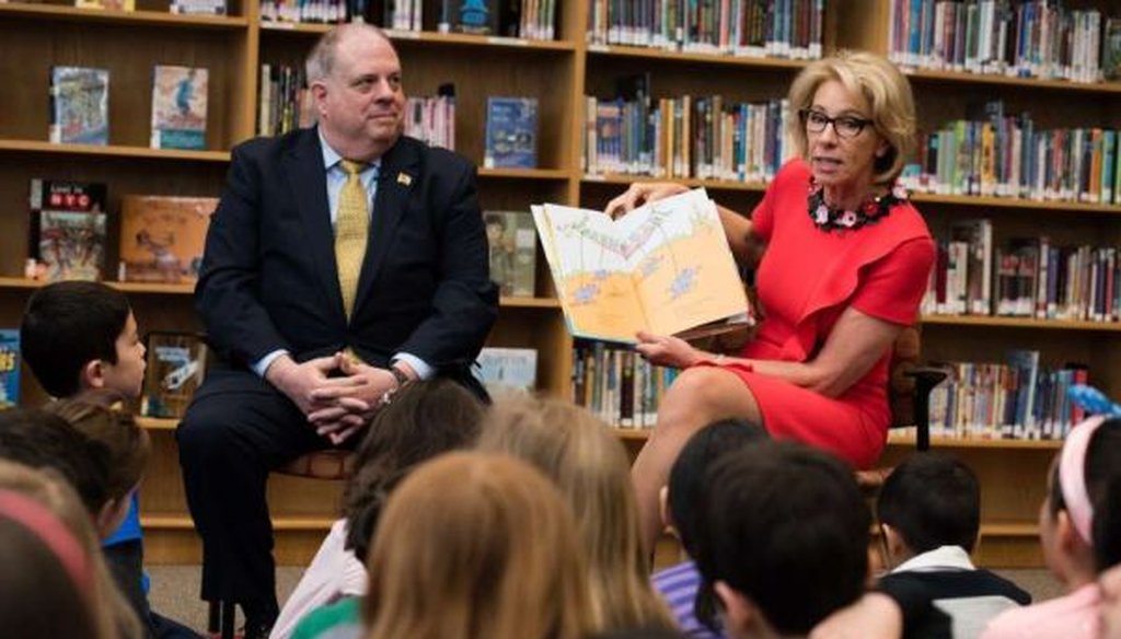 Trump administration Education Secretary Betsy DeVos, and Maryland Gov. Larry Hogan read to second-grade students at Carderock Springs Elementary School in Bethesda, Md. (Washington Post/Sarah L. Voisin)