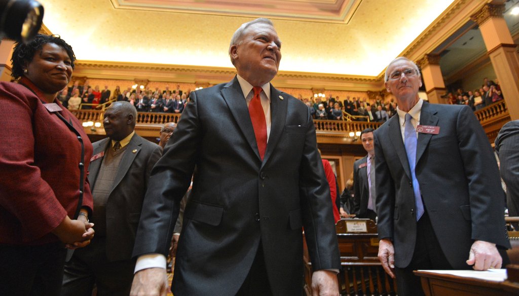 Georgia Gov. Nathan Deal is welcomed to the House floor before delivering the State of the State speech. Photo Credit: Brant Sanderlin/AJC.