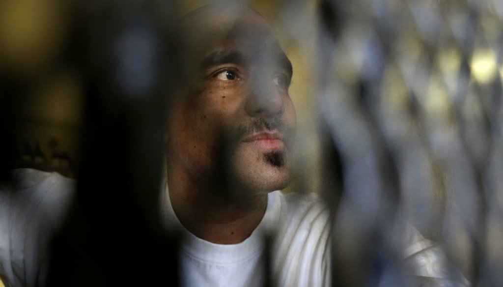 Condemned inmate Martin Navarette peers out his cell on death row at San Quentin State Prison near San Francisco, in December 2015. (AP Photo/Ben Margot)