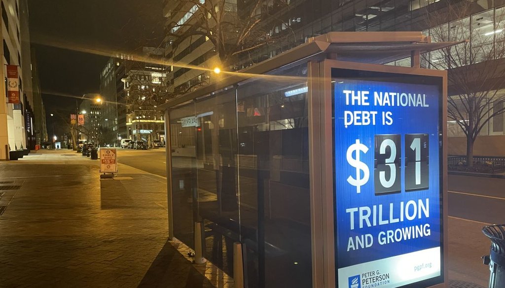 A sign warns about the high federal debt in downtown Washington, D.C. (Louis Jacobson/PolitiFact)