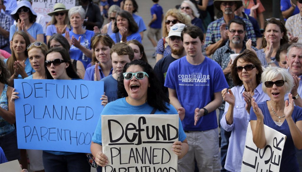 Videos showing Planned Parenthood officials discussing how they sometimes procure tissue from aborted fetuses for medical research led to calls, including at this rally in Austin, Texas in July 2015, to stop federal funding for the group. (AP photo)