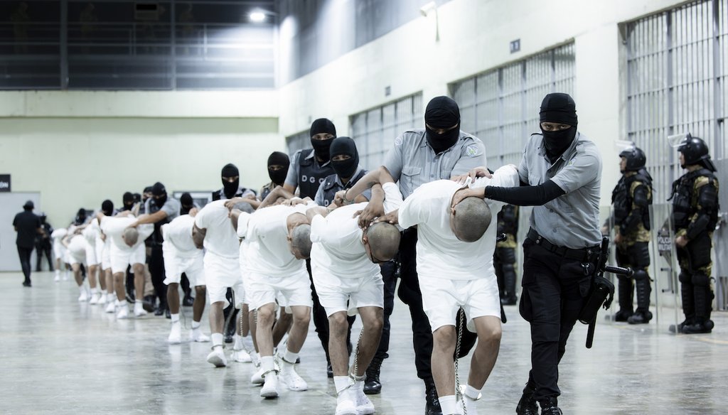 Prison guards transfer deportees from the U.S., alleged to be Venezuelan gang members, to the Terrorism Confinement Center in Tecoluca, El Salvador, March 16, 2025. (El Salvador presidential press office via AP)