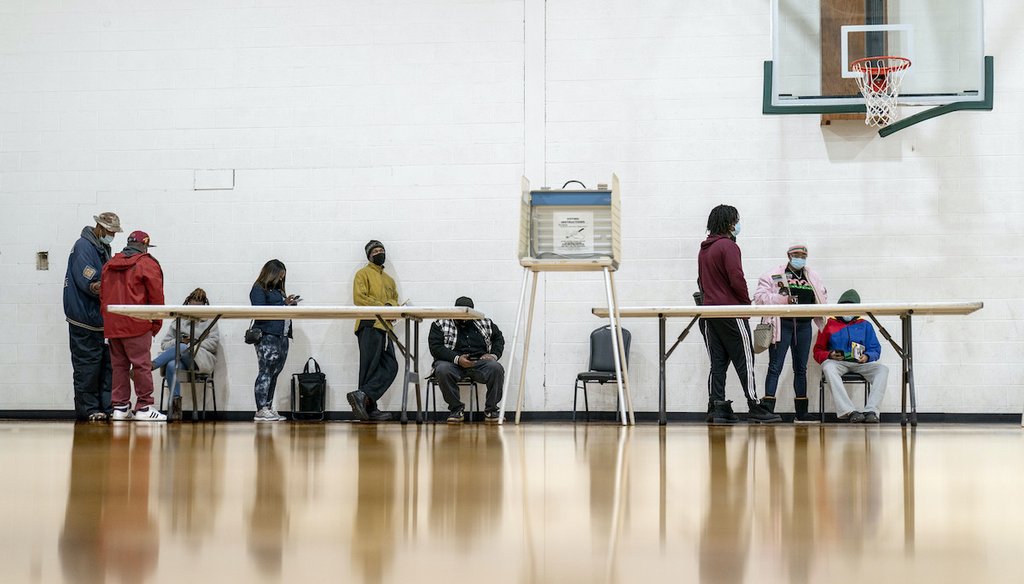 Voters wait in line to fill out a ballot on the last day of early absentee voting before the general election at the Northwest Activities Center in Detroit, Monday, Nov. 2, 2020. (AP)