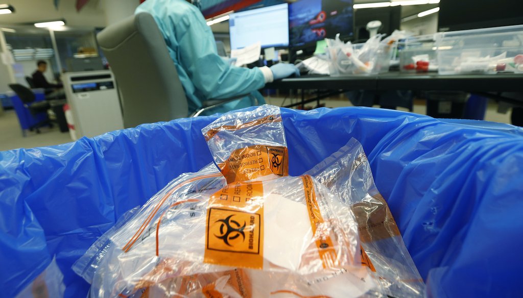 Discarded biohazard bags fill a trash can at Genetworx Clinical Lab in Richmond, Va. April 24, 2020 (AP Photo/Steve Helber)
