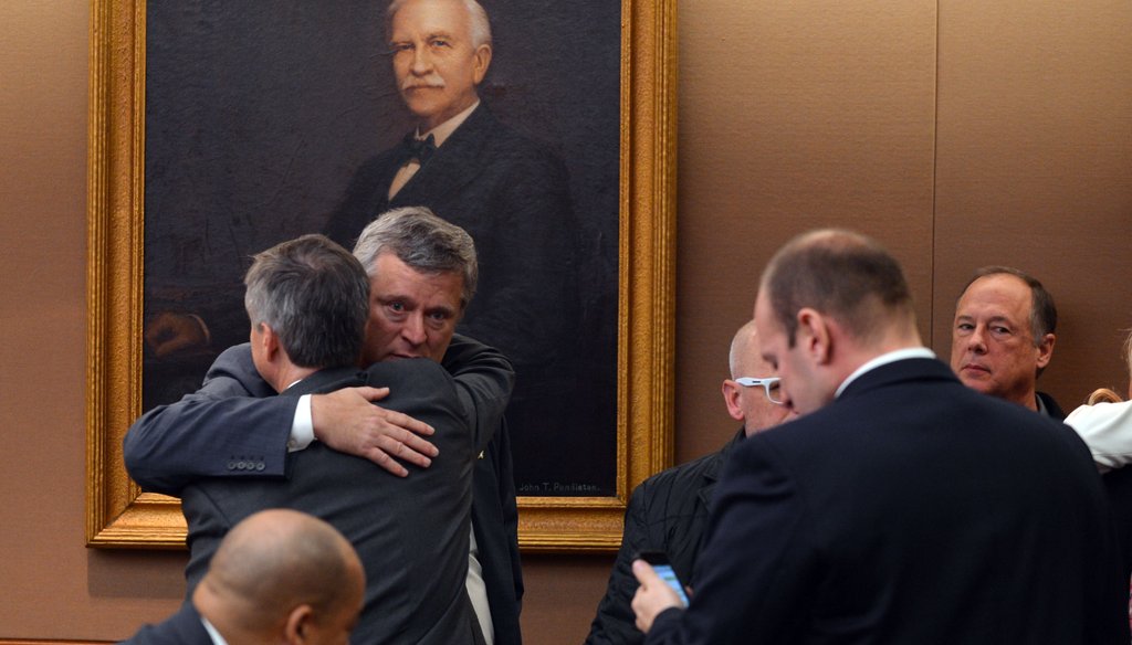 Georgia state Sen. Don Balfour, R-Snellville, hugs his attorney, Ken Hodges, after being acquitted in his recent trial. Photo credit: Brant Sanderlin/AJC.