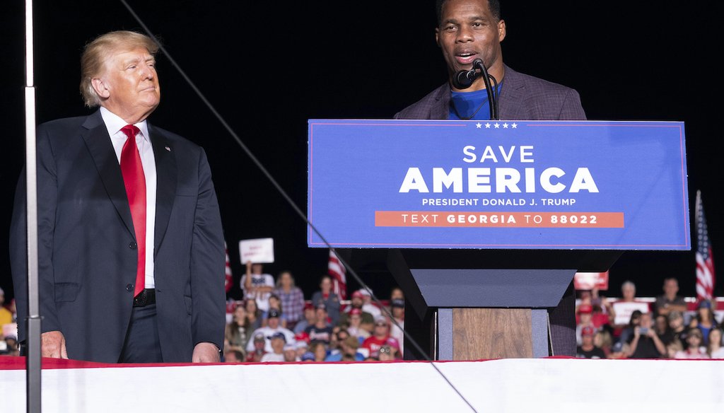 Former President Donald Trump listens as Georgia U.S. Senate candidate Herschel Walker speaks during Trump's Save America rally in Perry, Ga., on Sept. 25, 2021. (AP)