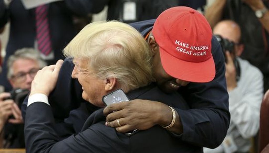 Kanye West embraces President Donald Trump in the Oval Office during a visit on Oct. 11, 2018. (Getty Images)