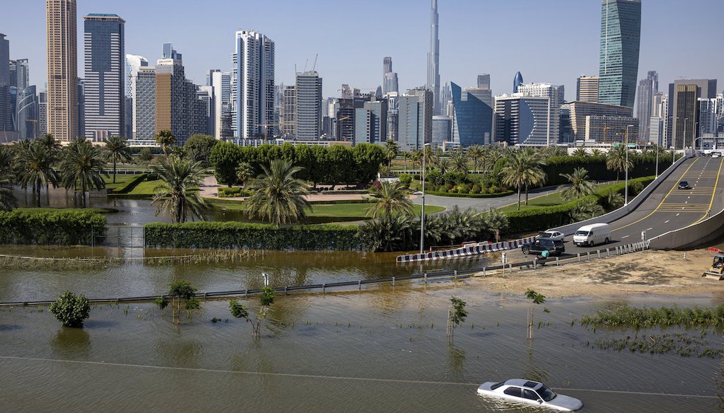 An abandoned vehicle stands April 18, 2024, in floodwater on caused by heavy rain in Dubai, United Arab Emirates. (AP)