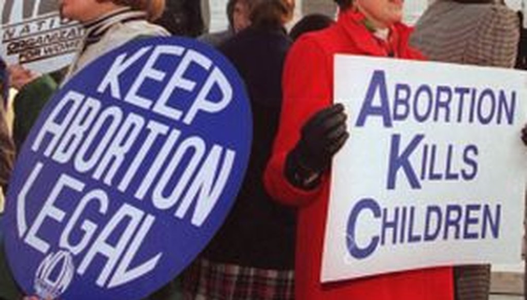 Protestors express opposite views on abortion. 