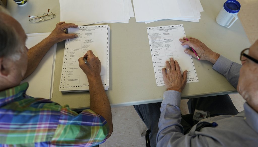 Democratic Franklin County Commissioner Bob Ziobrowski, right, and Republican Franklin County election board member Jerry Warnement, left, duplicate damaged absentee and mail-in ballots after the Pennsylvania election in Chambersburg on May 18, 2022.(AP)