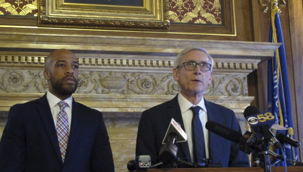 Gov. Tony Evers (right) says he told told Republican lawmakers that he will push for Medicaid expansion, but won't propose eliminating the state's economic development agency Jan. 15, 2019, in Madison. At left is Lt. Gov. Mandela Barnes. /Associated Press