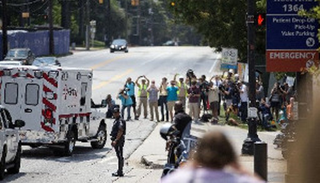 An ambulance transporting Nancy Writebol, an American missionary stricken with Ebola, arrives at Emory University Hospital, Tuesday, Aug. 5, 2014, in Atlanta. She joins another U.S. aid worker, Dr. Kent Brantly, in a special isolation unit. (AP Photo)