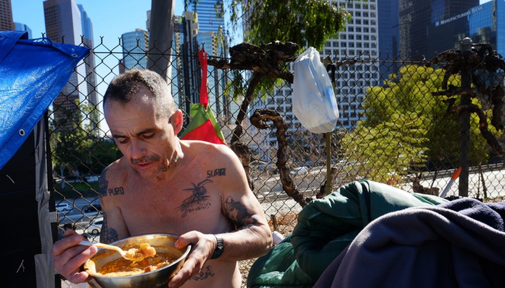 This Tuesday, Jan. 26, 2016 file photo Eddie, 51, a homeless man who would only give his first name and lives in a tent on the street in downtown Los Angeles. (AP Photo/Richard Vogel)