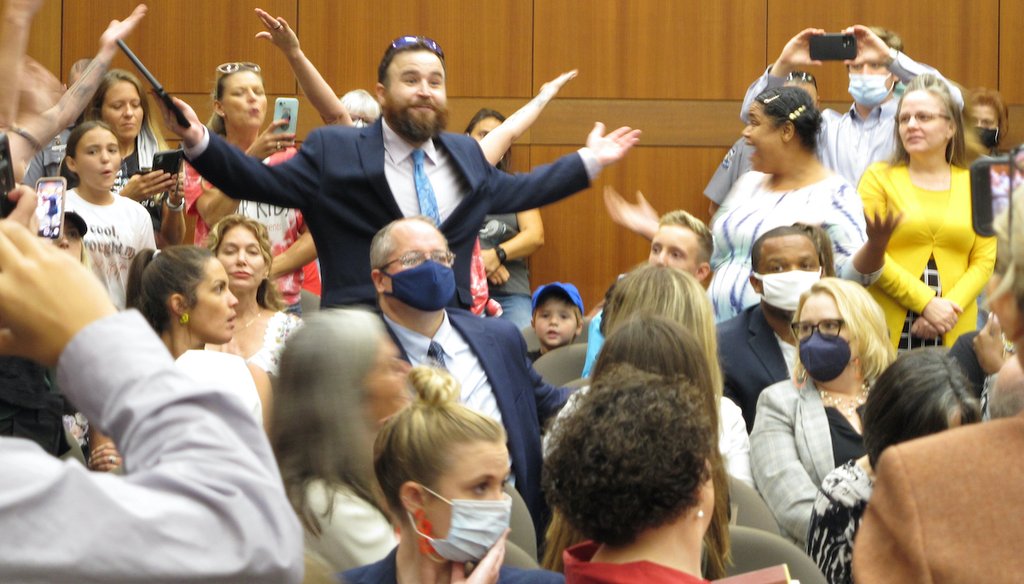 A crowd of angry, largely unmasked people objecting to Louisiana Gov. John Bel Edwards' mask mandate for schools shouts in opposition to wearing a mask at the Board of Elementary and Secondary Education meeting, Aug. 18, 2021, in Baton Rouge, La. (AP)