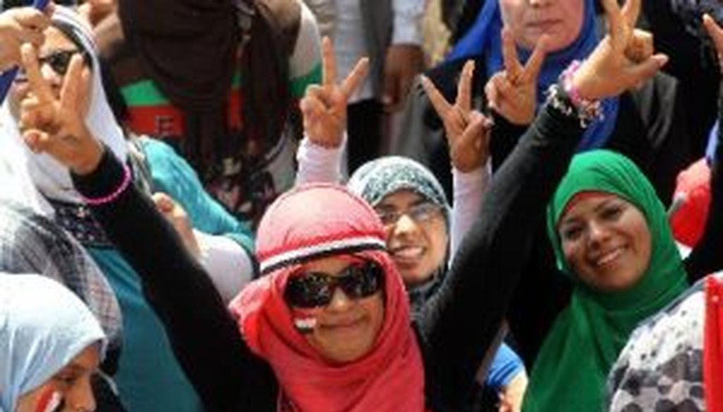 Egyptian women in Cairo's Tahrir square flash victory signs on July 4, 2013, one day after the announcement of a presidential handover.