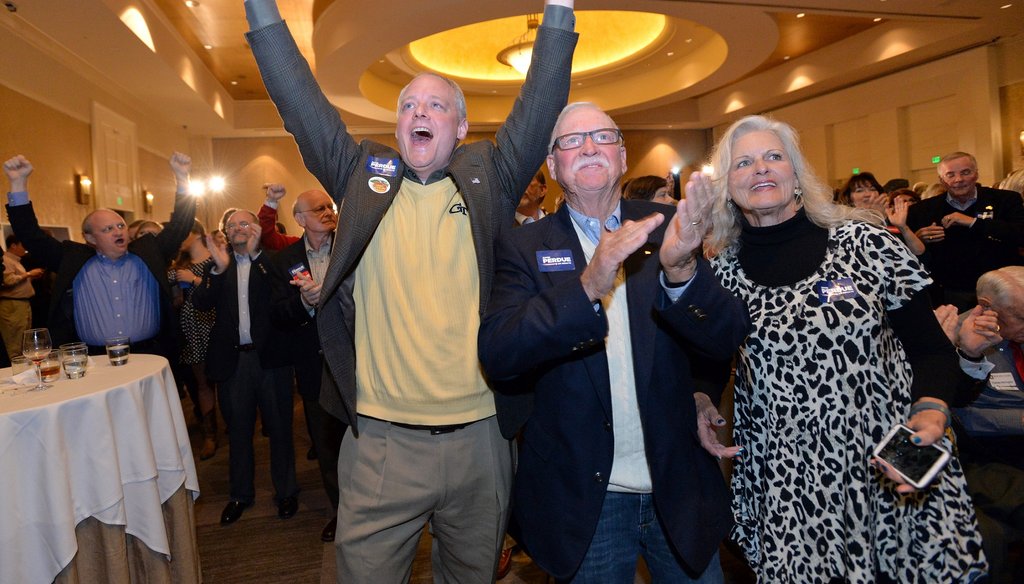 Supporters of GOP candidate for U.S. Senate David Perdue celebrate his victory Tuesday night at a party at the InterContinental  Buckhead in Atlanta. Photo by Hyosub Shin / AJC.