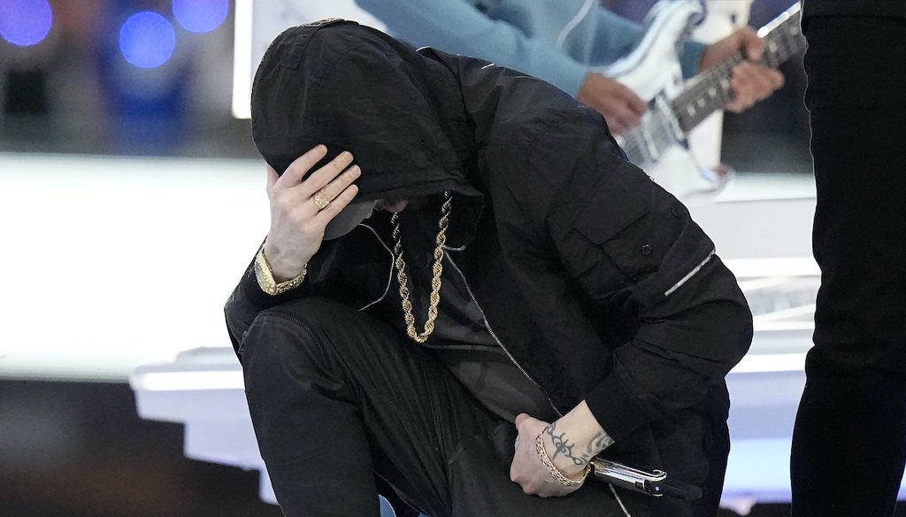 Eminem kneels during the halftime performance at the NFL Super Bowl 56 football game between the Los Angeles Rams and the Cincinnati Bengals, Feb. 13, 2022. (AP)