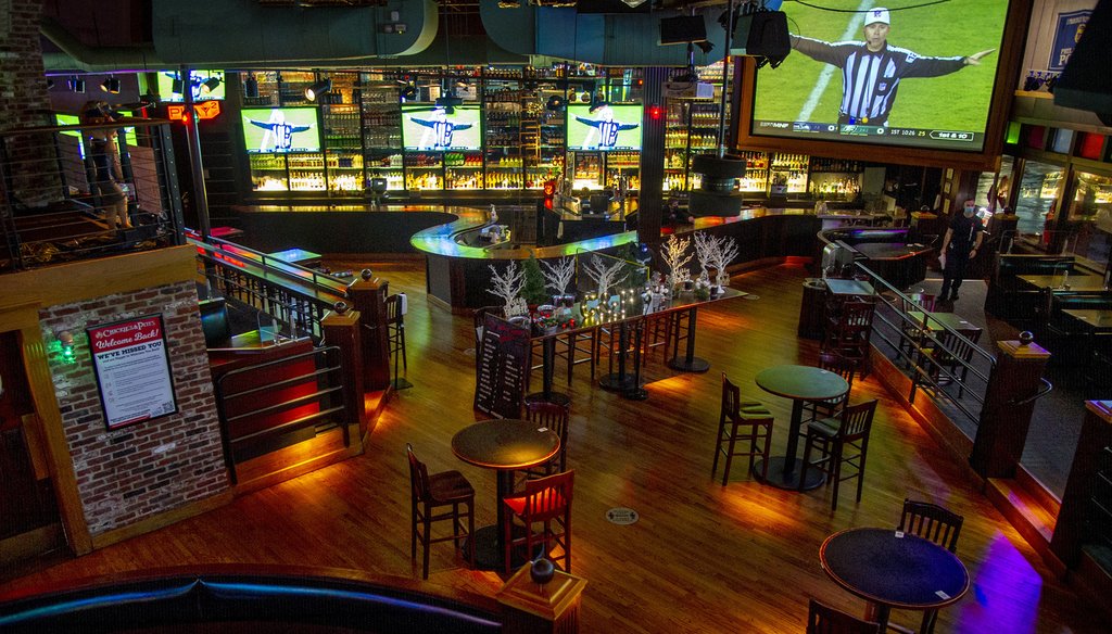 The normally packed Chickie & Pete's sports bar and restaurant in South Philadelphia is empty during the Eagles Monday Night Football game, since the city instituted ban on indoor dining. TOM GRALISH / Inquirer Staff Photographer