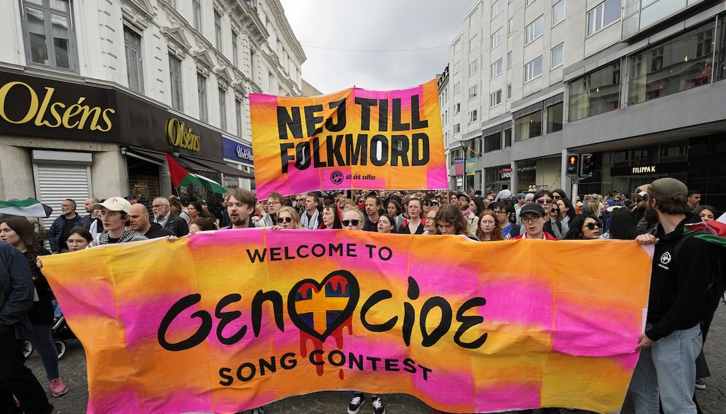 Protesters hold up a banner with the words in Swedish "No To Genocide" during a demonstration that promoted excluding Israel from Eurovision ahead of the second semi-final at the Eurovision Song Contest in Malmo, Sweden on May 9, 2024. (AP)