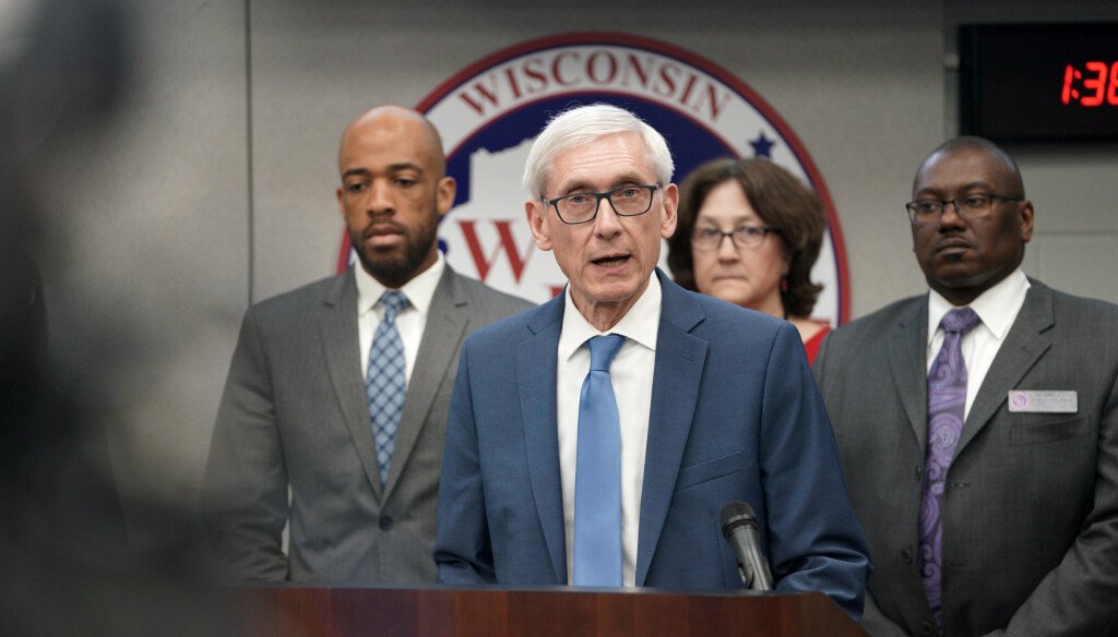 In this March 12, 2020 file photo, Gov. Tony Evers declares a public health emergency in Madison, Wis. Evers has ordered a ban on all gatherings of more than 50 people (Steve Apps/Wisconsin State Journal via AP)