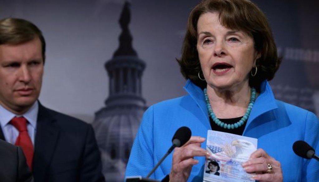 Senate Intelligence ranking member Dianne Feinstein, D-Calif., holds up her passport during a news conference at the Capitol on Nov. 19, 2015. (Chip Somodevilla/Getty Images) 