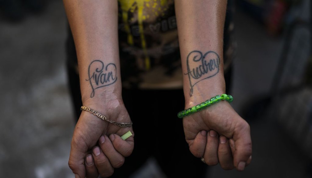 Jennifer Catano, a 27-year-old fentanyl addict, shows tattoos of the names of her two children, Evan and Audrey, in Los Angeles on Aug. 23, 2022. (AP)