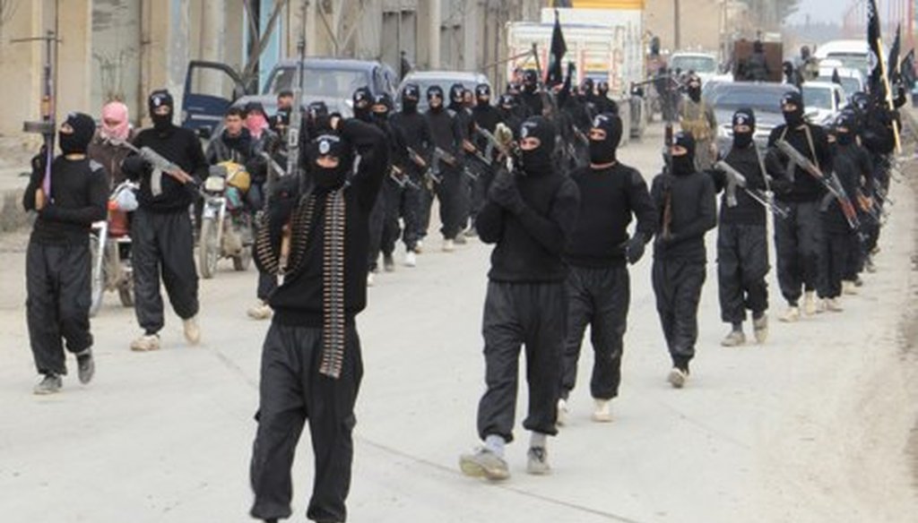 Fighters of the Islamic State of Iraq in Syria parade in Tel Abyad. Syrian rebels' uneasy co-existence with the hardline Isis has turned to outright hostility. (Reuters)