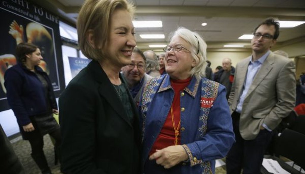 Republican presidential candidate Carly Fiorina laughs with Lynn Seydel of Ames, Iowa, right, during the Iowa Right to Life Presidential Forum on Jan. 20, 2016, in Des Moines, Iowa. (AP/Charlie Neibergall)
