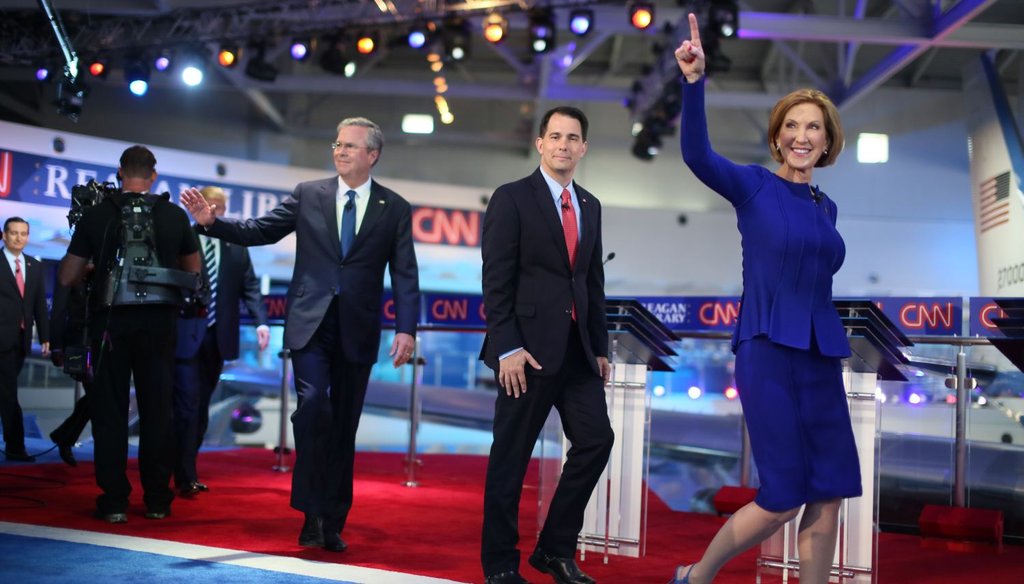 Republican presidential candidates Carly Fiorina, Wisconsin Gov. Scott Walker and Jeb Bush walk onstage at the Reagan Library on Sept. 16, 2015 in Simi Valley, Calif. (Getty Images)