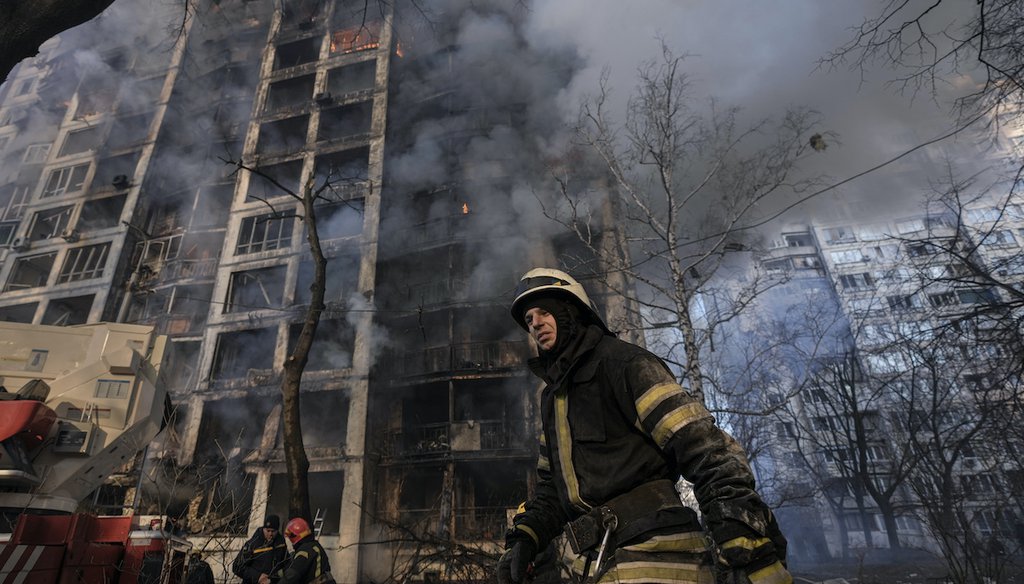 A firefighter walks outside a destroyed apartment building after a bombing in a residential area in Kyiv, Ukraine, on March 15, 2022. (AP)