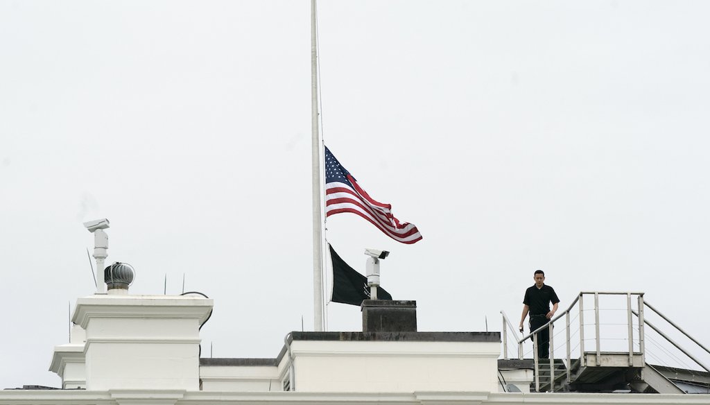 An American flag flies at half-staff at the White House, Tuesday, May 24, 2022, in Washington, to honor the victims of the mass shooting at Robb Elementary School in Uvalde, Texas. (AP)
